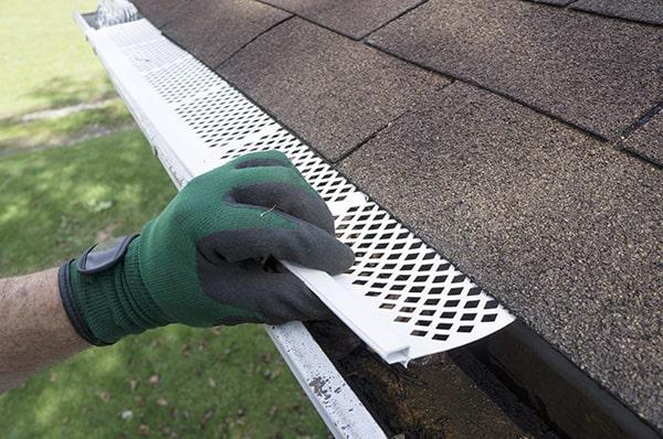 gutter guards act as a barrier to prevent leaves, twigs, and other debris from entering and clogging your gutters